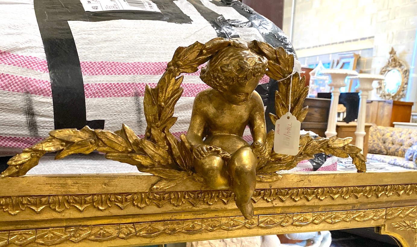 A Victorian giltwood and composition overmantle mirror with cherub pediment width height